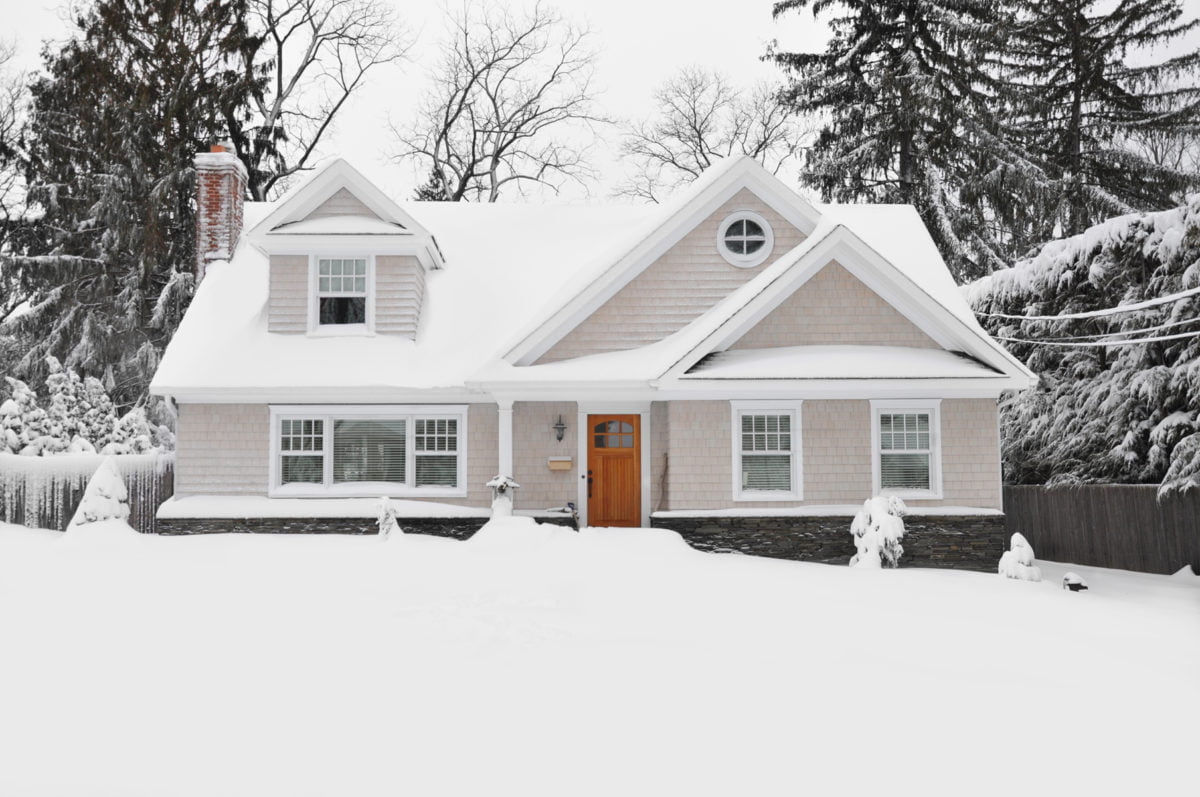 Snow Covered Cape Cod Style Home